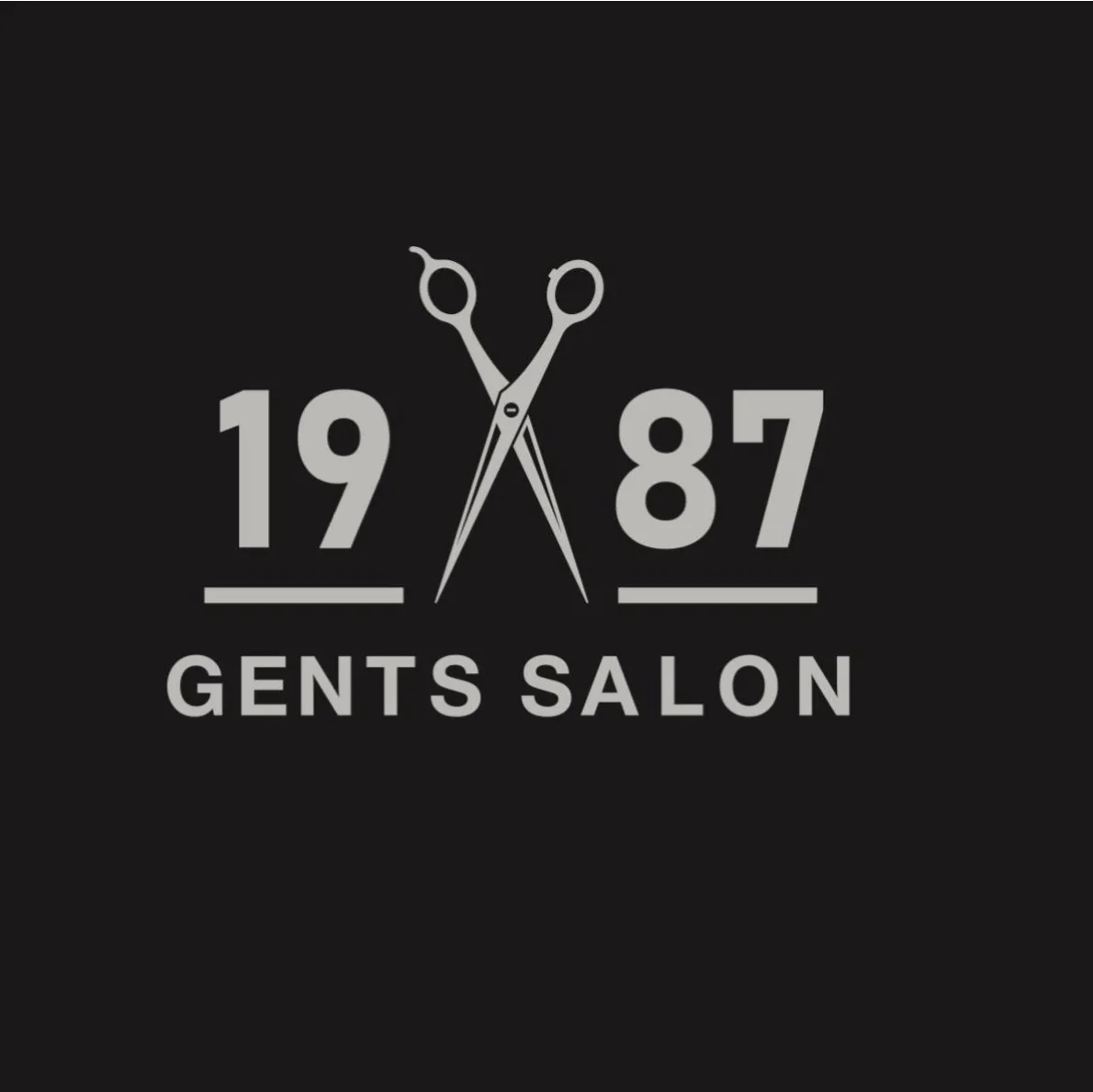 Interior of 1987 Gents Salon with barber chairs, mirrors, warm wood and product shelving