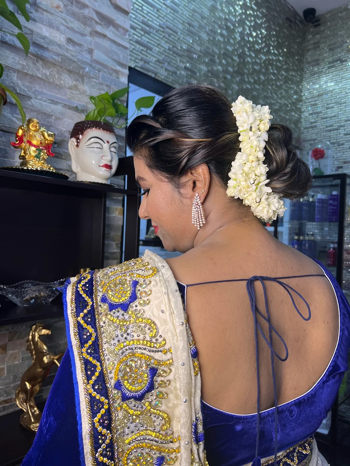 Bridal updo with jasmine flowers and occasion styling
