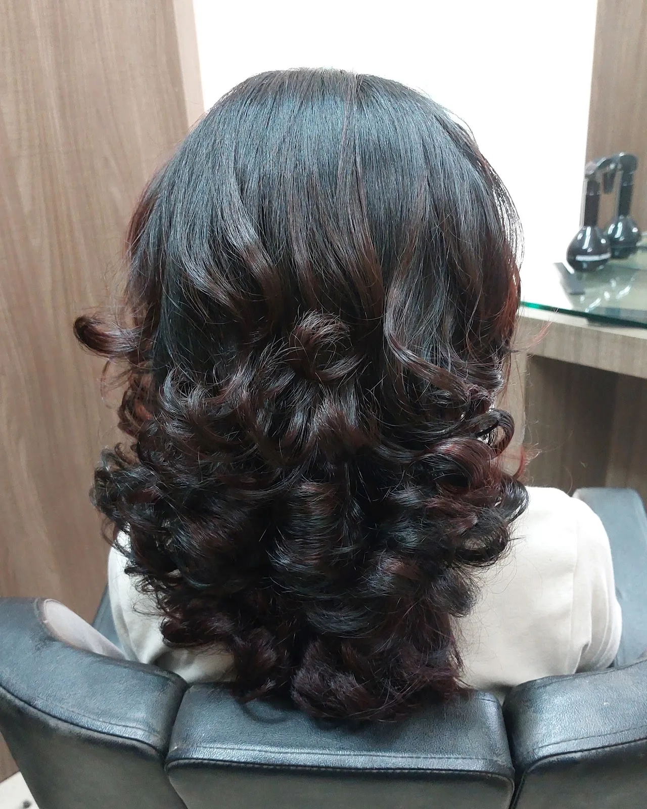 Soft bouncy curls and blow-dry styled at Tint Saloon
