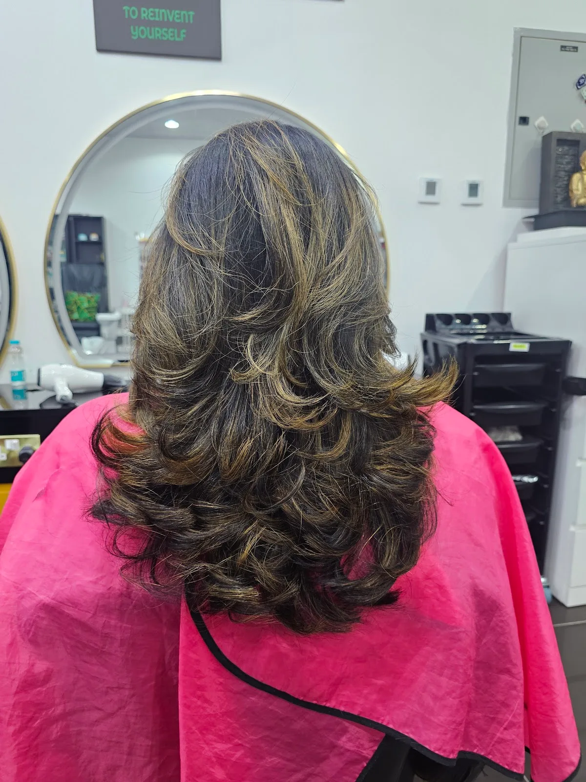 Layered blow-dry with honey highlights