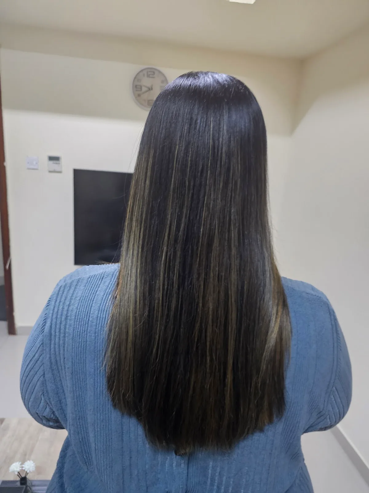 Sleek glossy straight hair after smoothing treatment