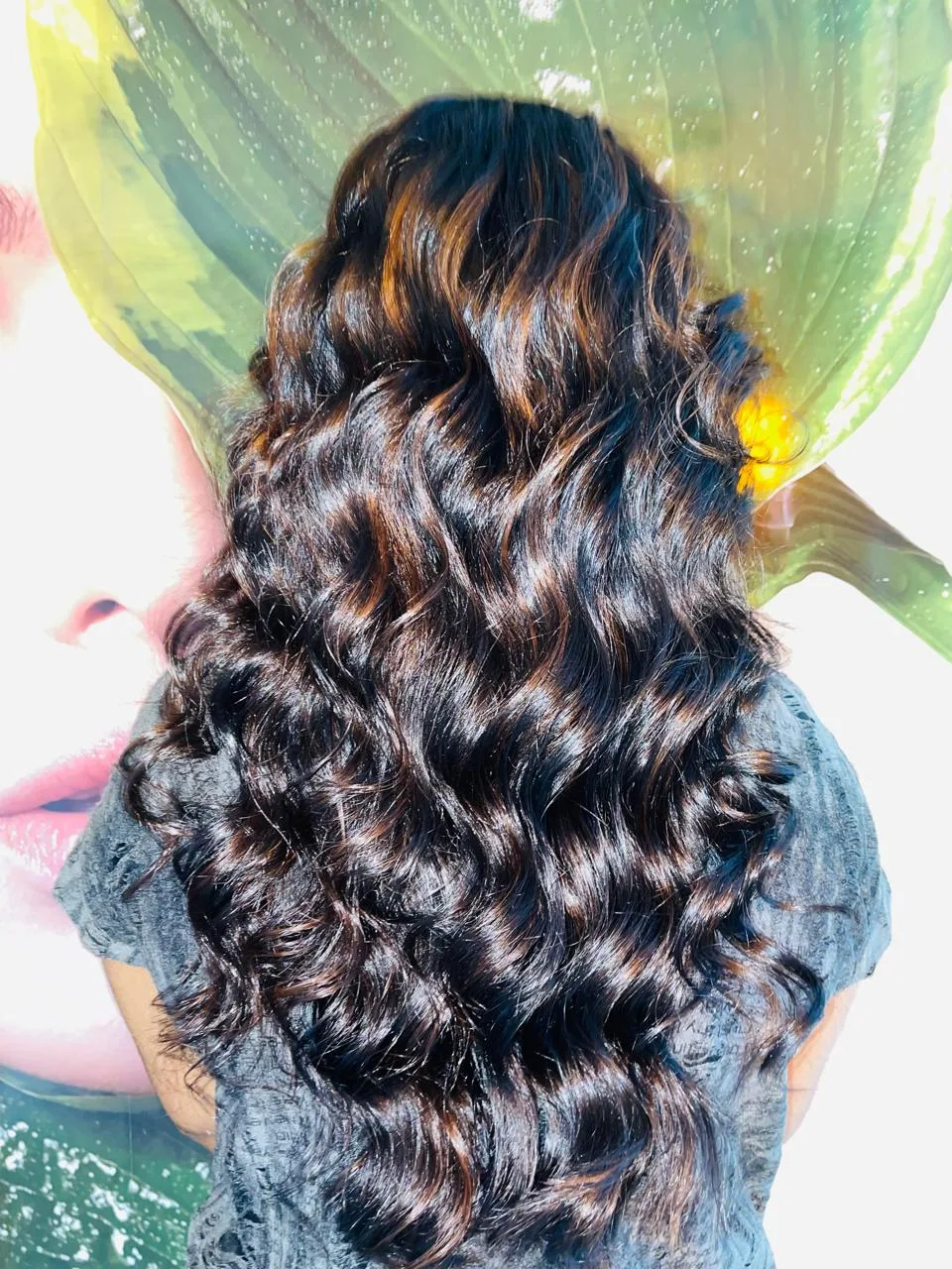 Glossy chocolate waves with caramel balayage styled at Tint Saloon