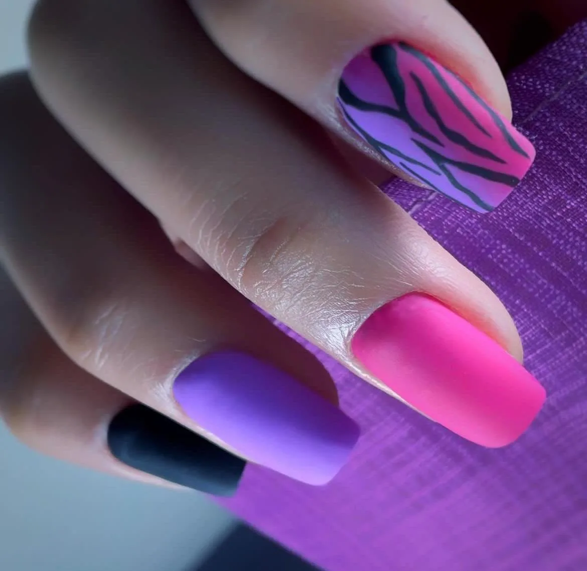 Pink and lilac nail art done at the Tint Saloon nail station