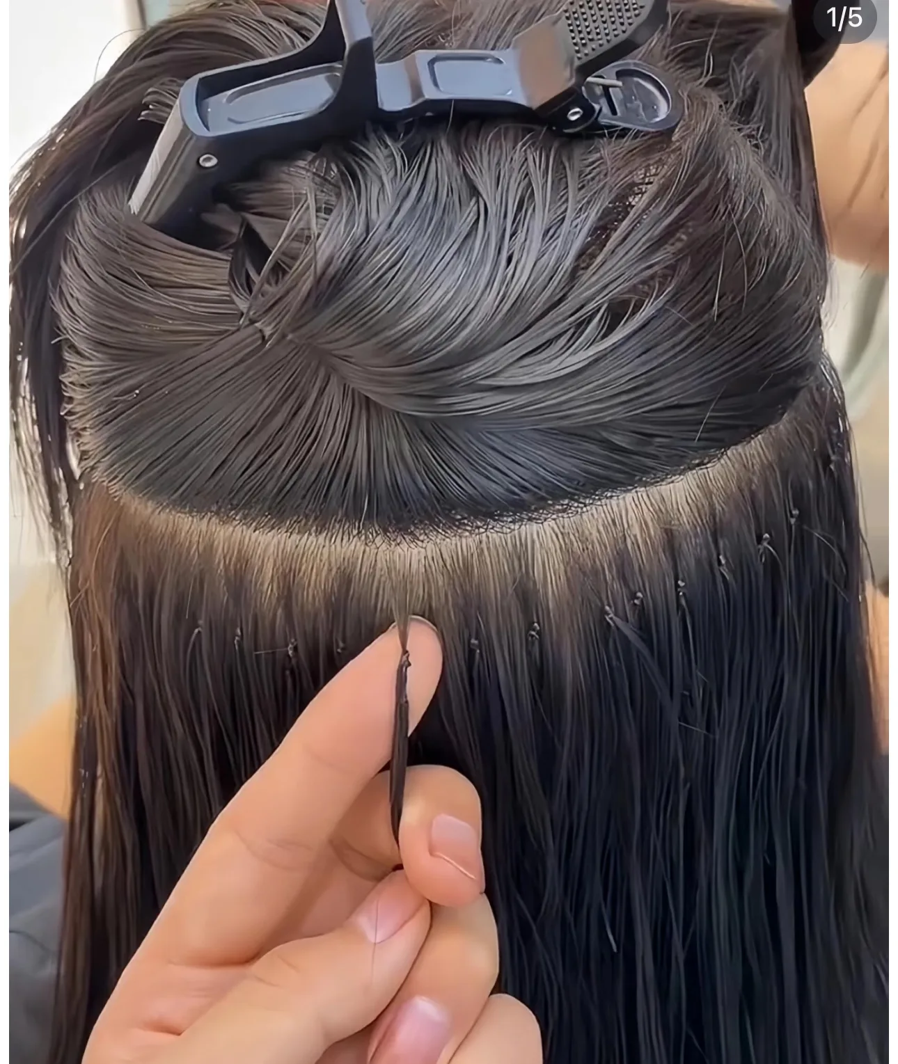 Hair extensions being applied for added length