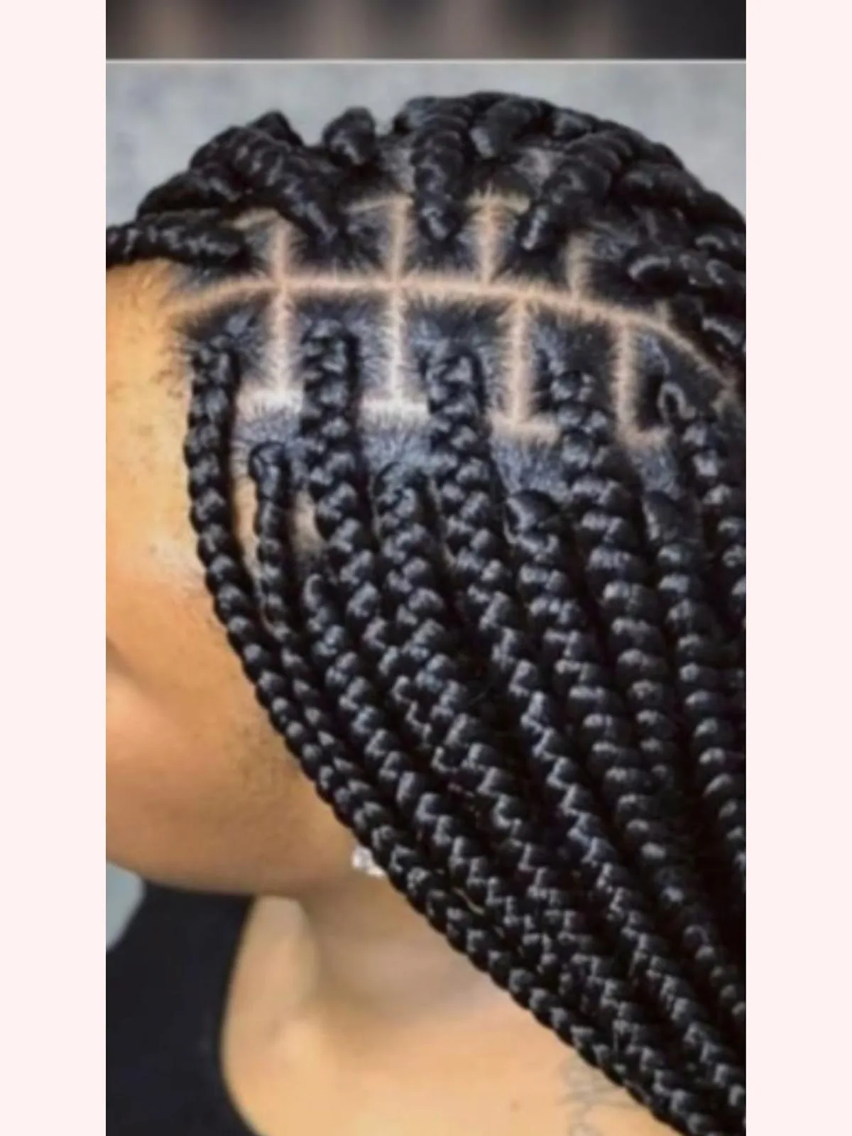 Neatly parted box braids close-up
