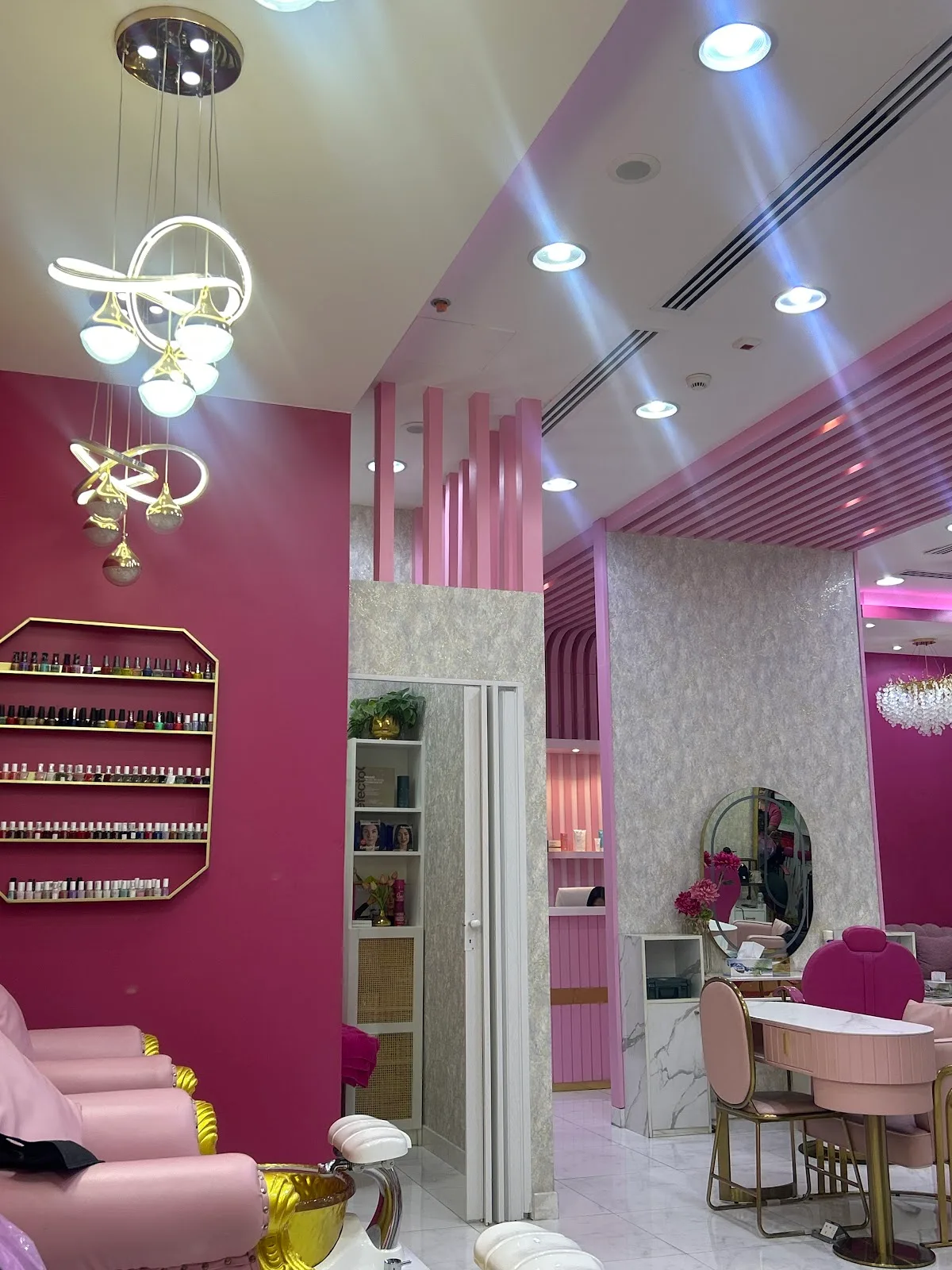 Interior of the ladies beauty centre with pink styling stations