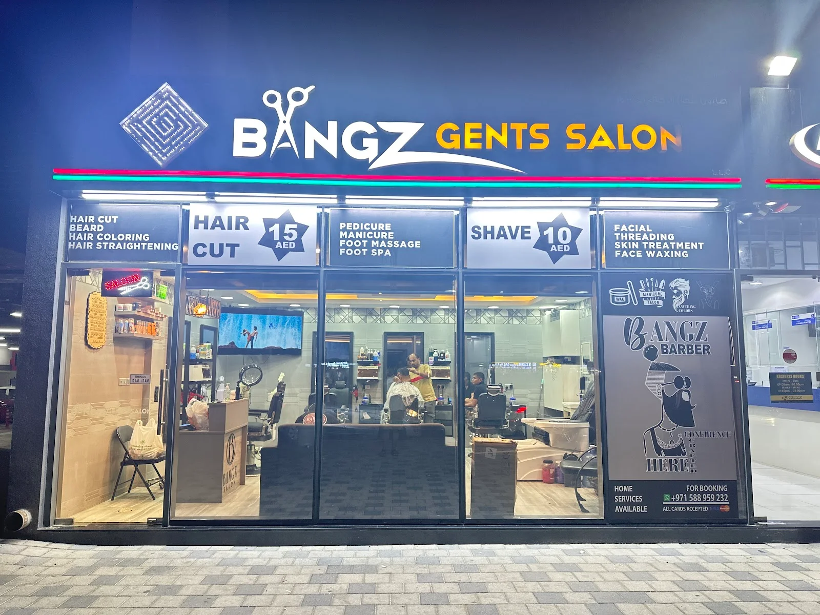 Bangz Gents Salon storefront lit up at night in Warsan 1, Dubai