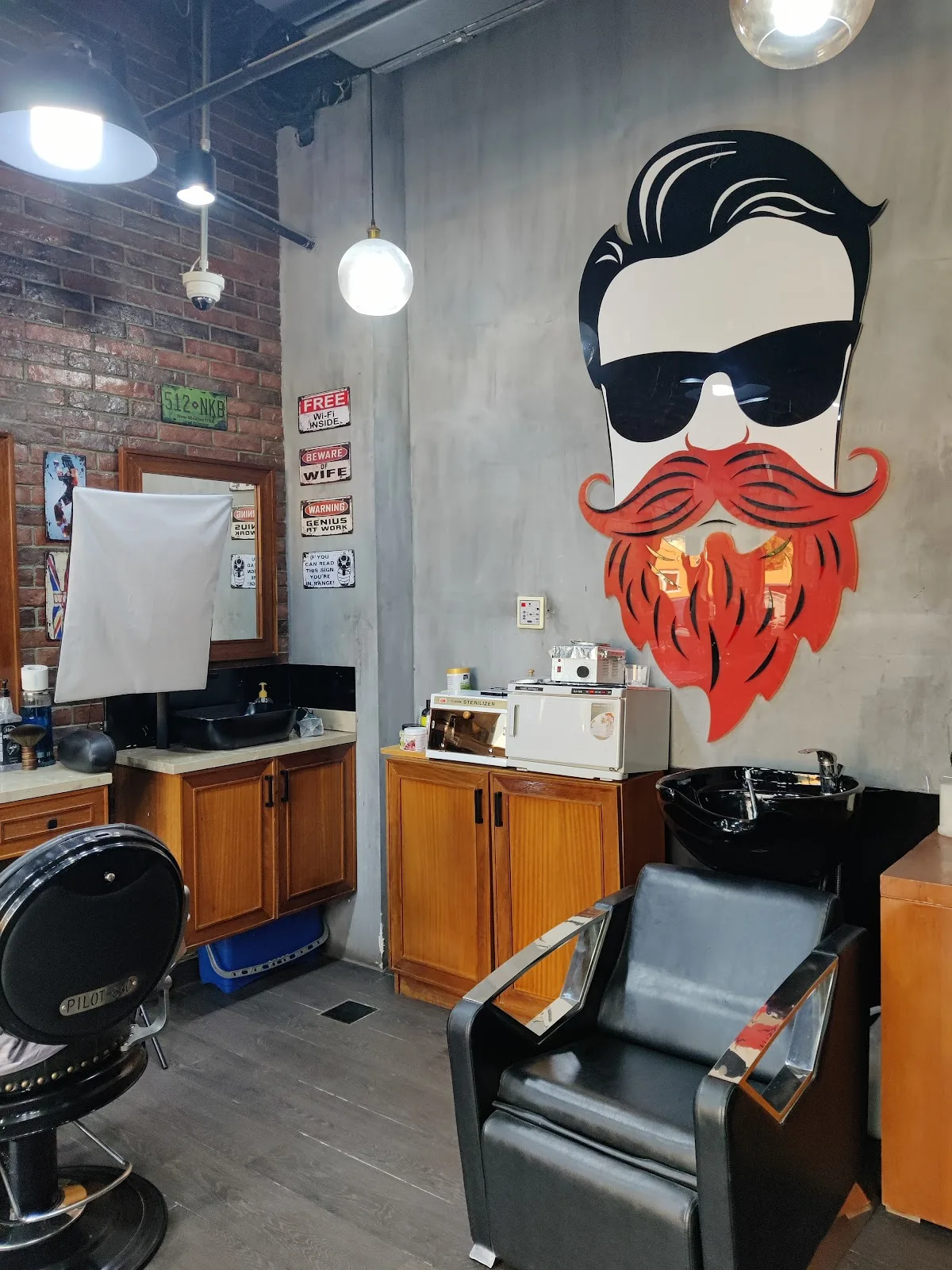Styling station beneath the red-bearded mascot mural