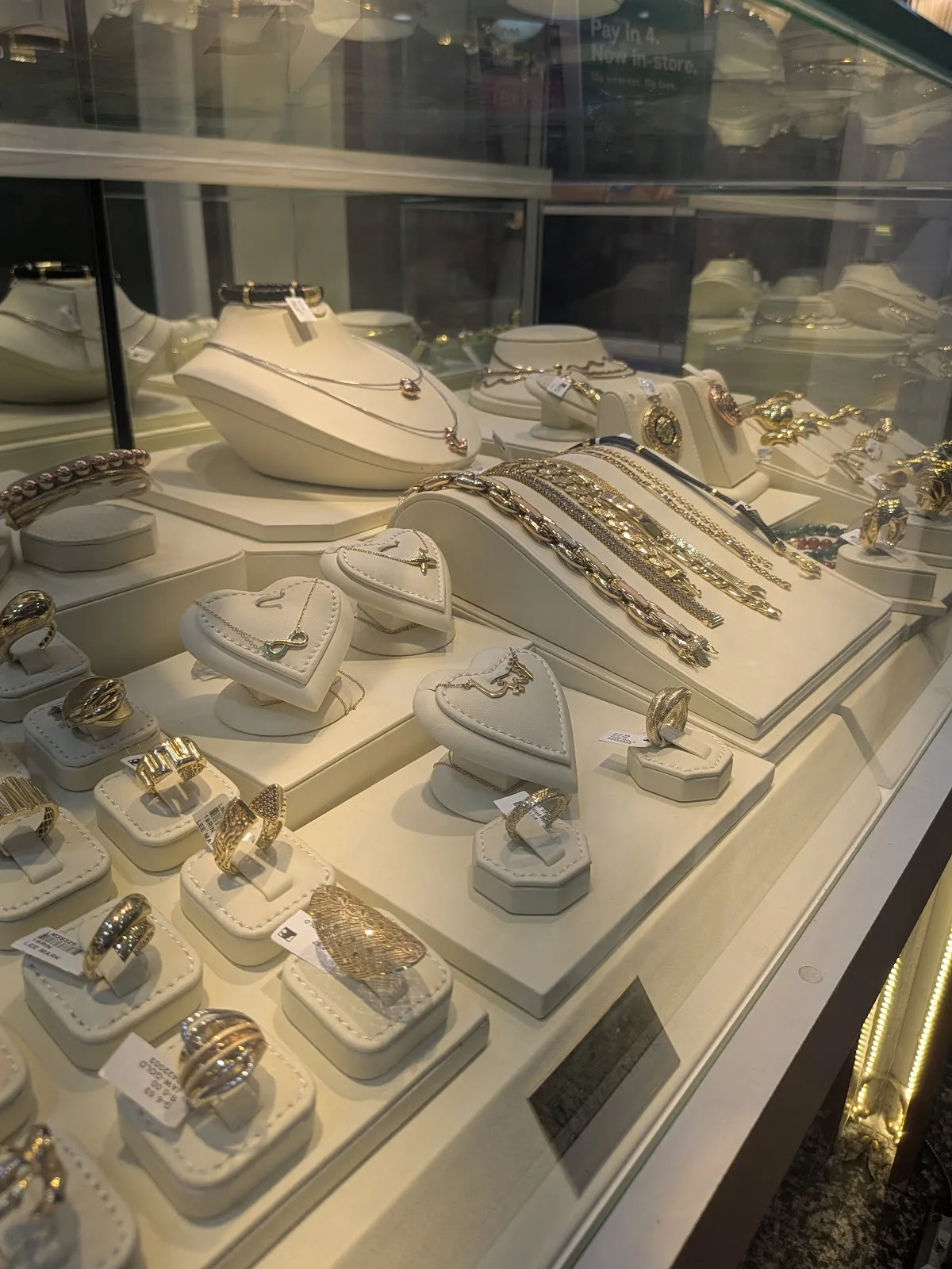 Pendants, rings and earrings in a display case