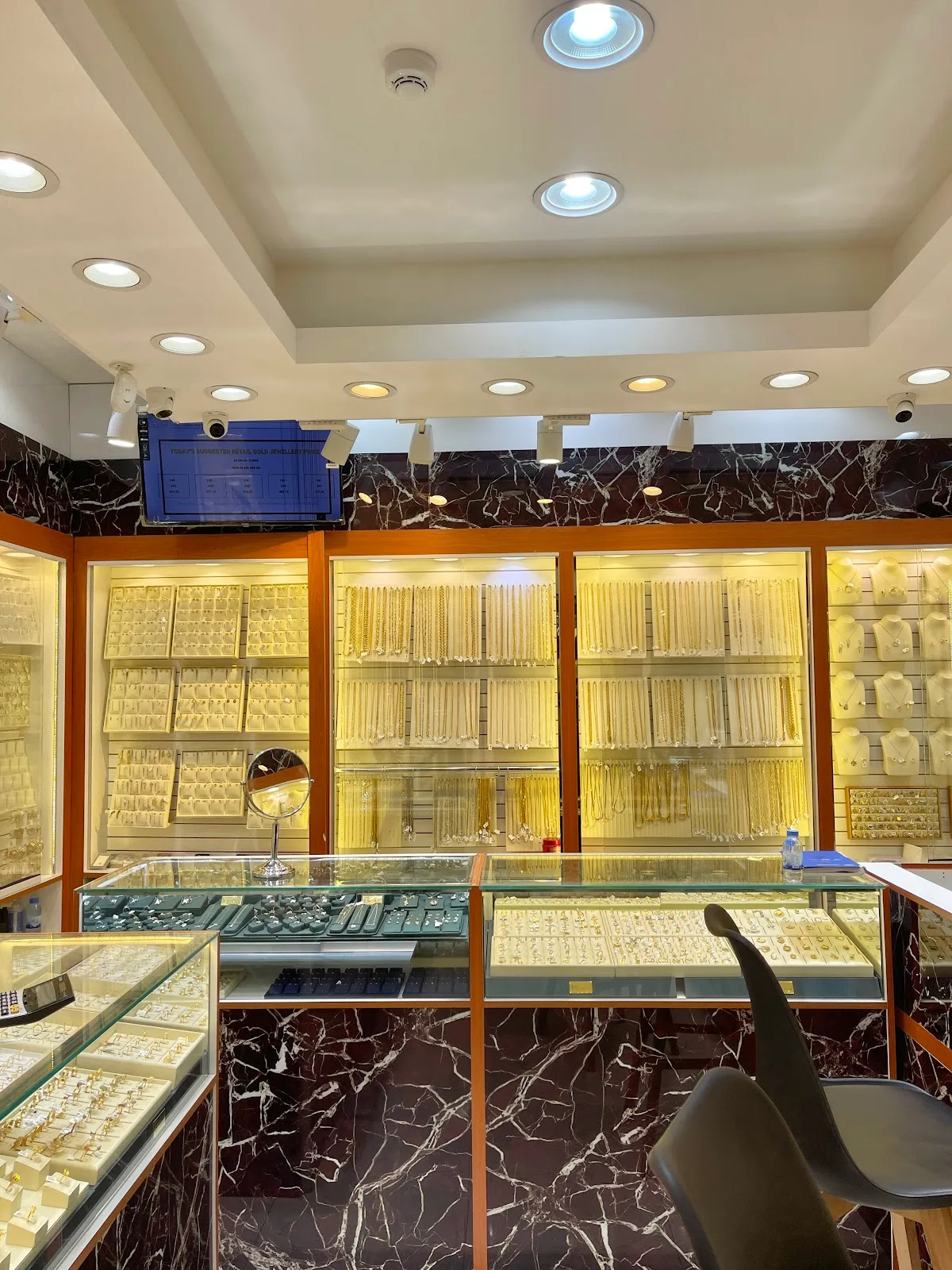 Wide view of the gold-filled store interior