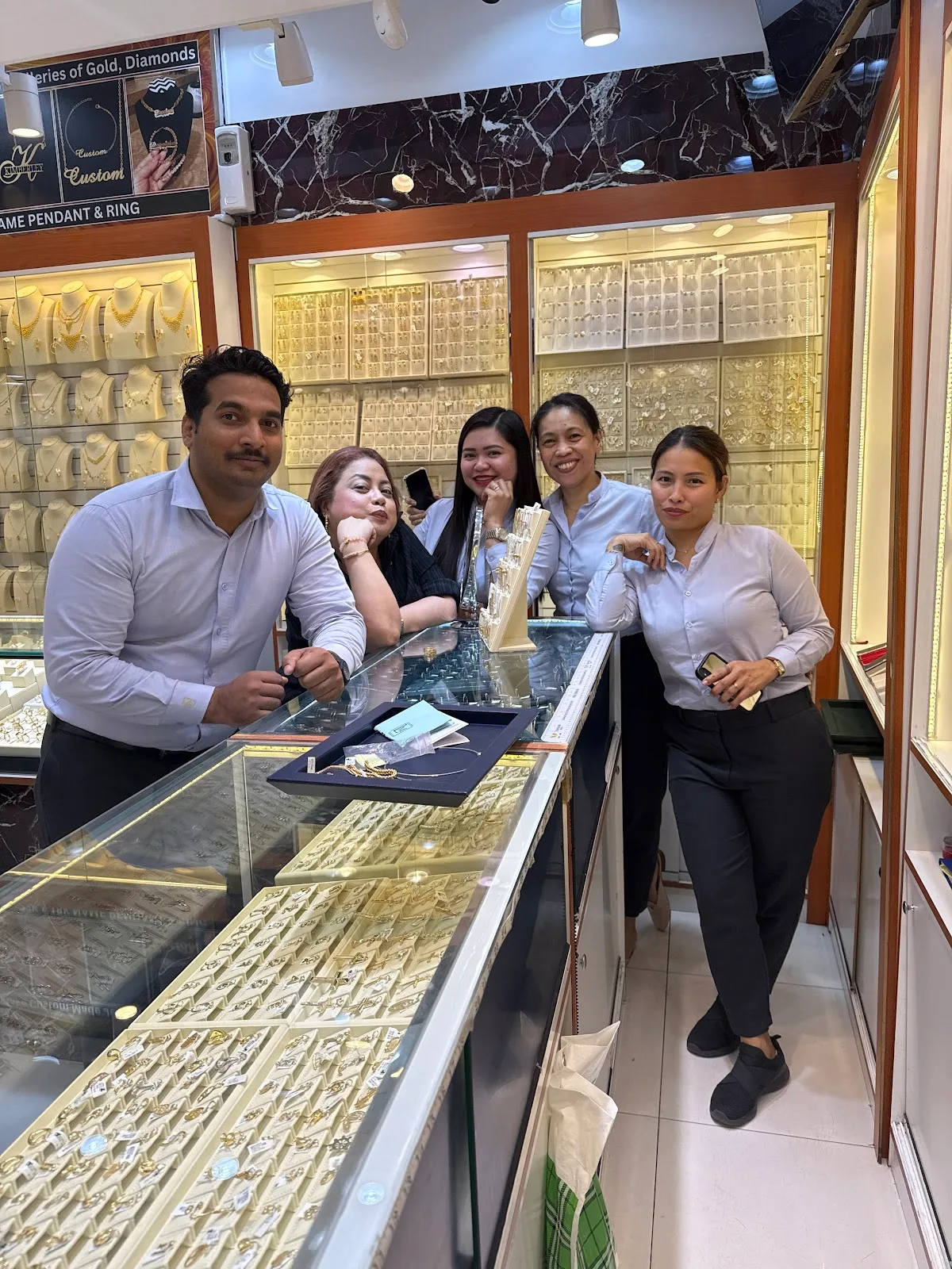 The Lee Mark Jewellery team behind the counter