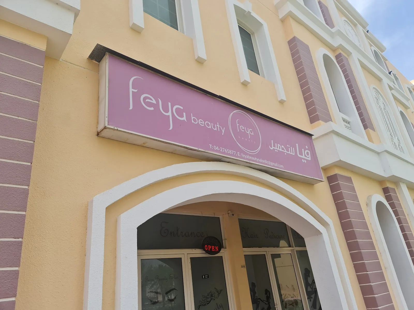 Feya Beauty Salon storefront with pink signage in International City, Dubai