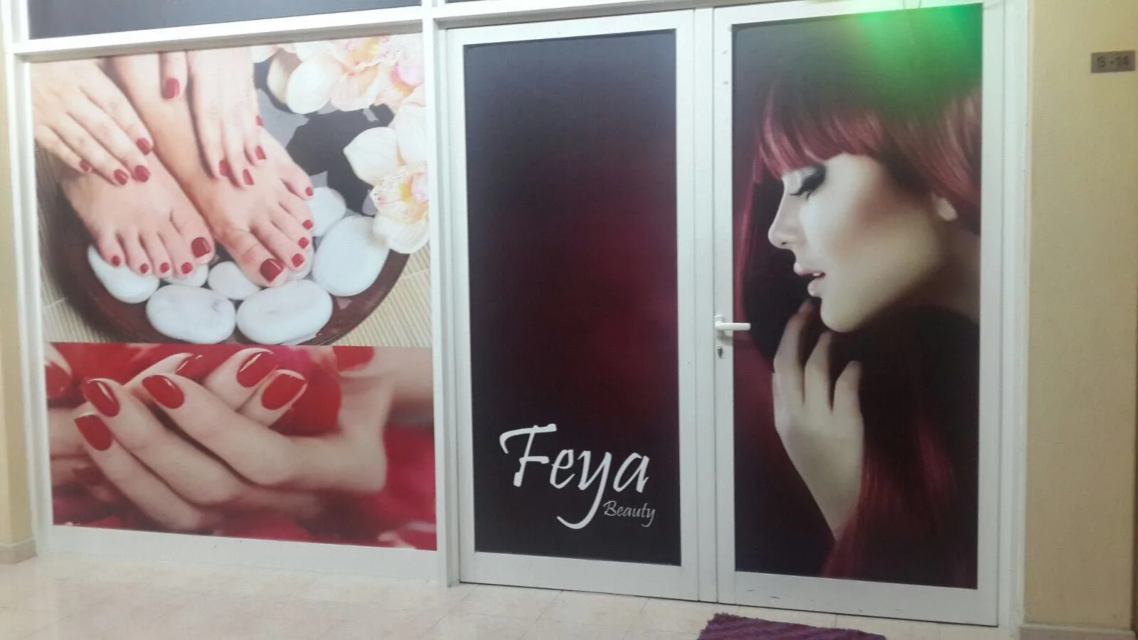Feya Beauty Salon door artwork showing hair and nail services