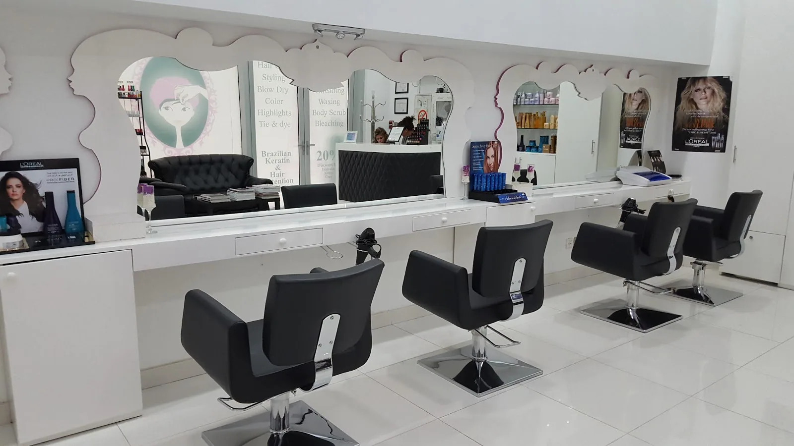 The styling rail and scalloped mirrors inside La Parisienne