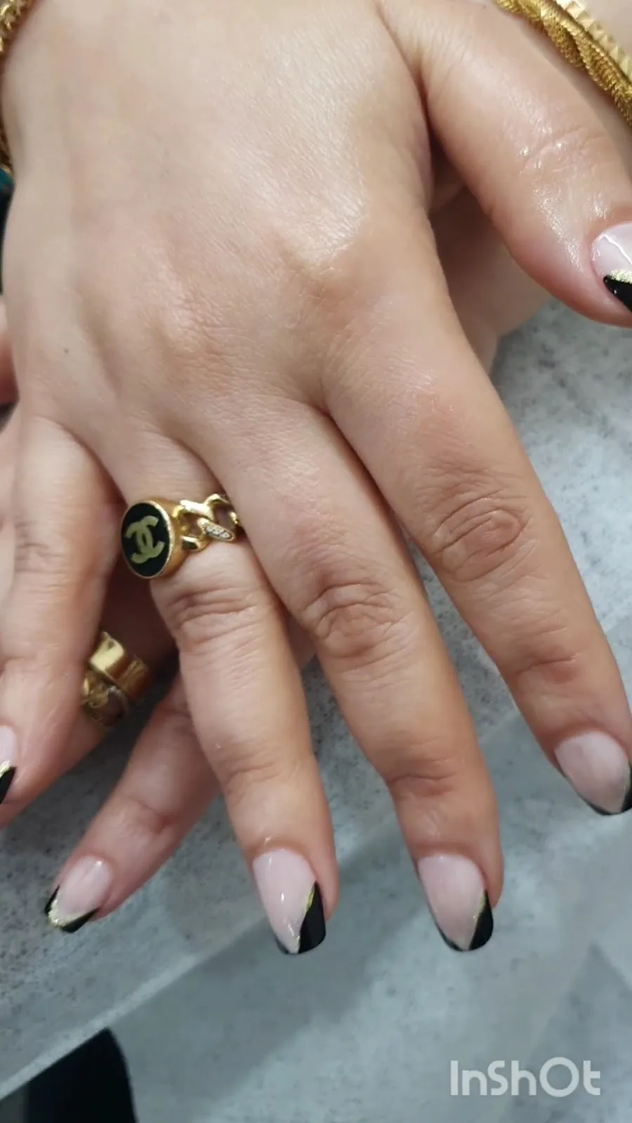 Black and gold French tip nails