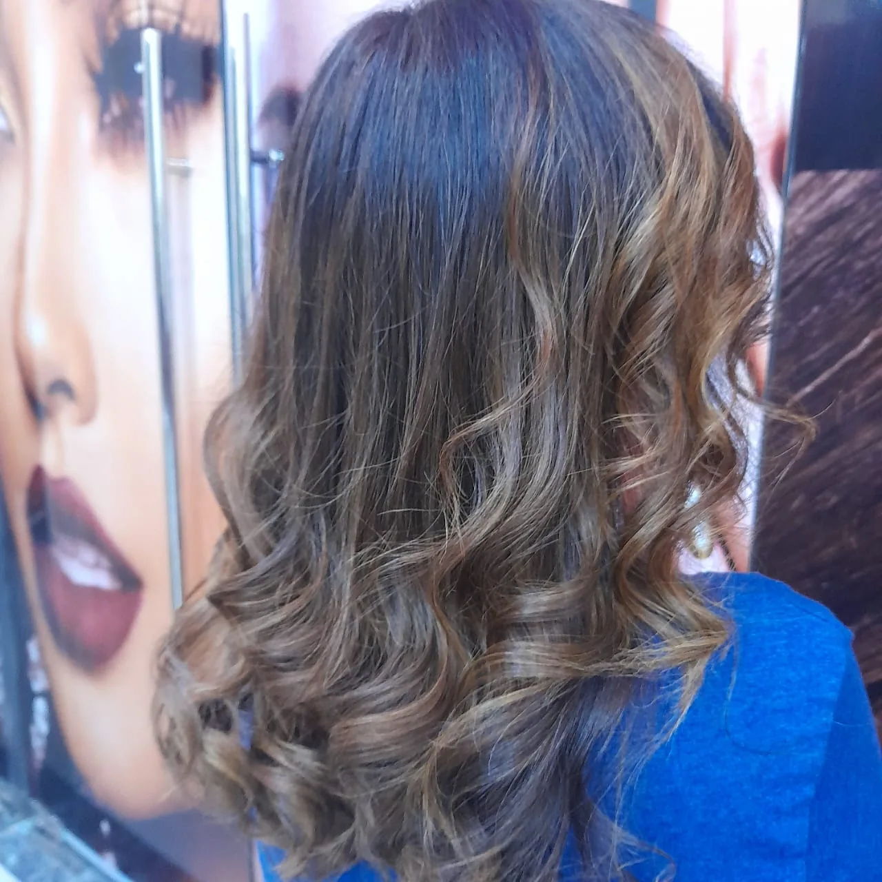 Soft balayage curls styled at the salon