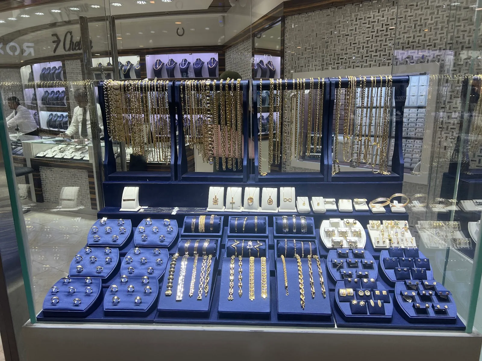 A display case of gold chains, necklaces, bracelets and pendants at Chetan Jewellers
