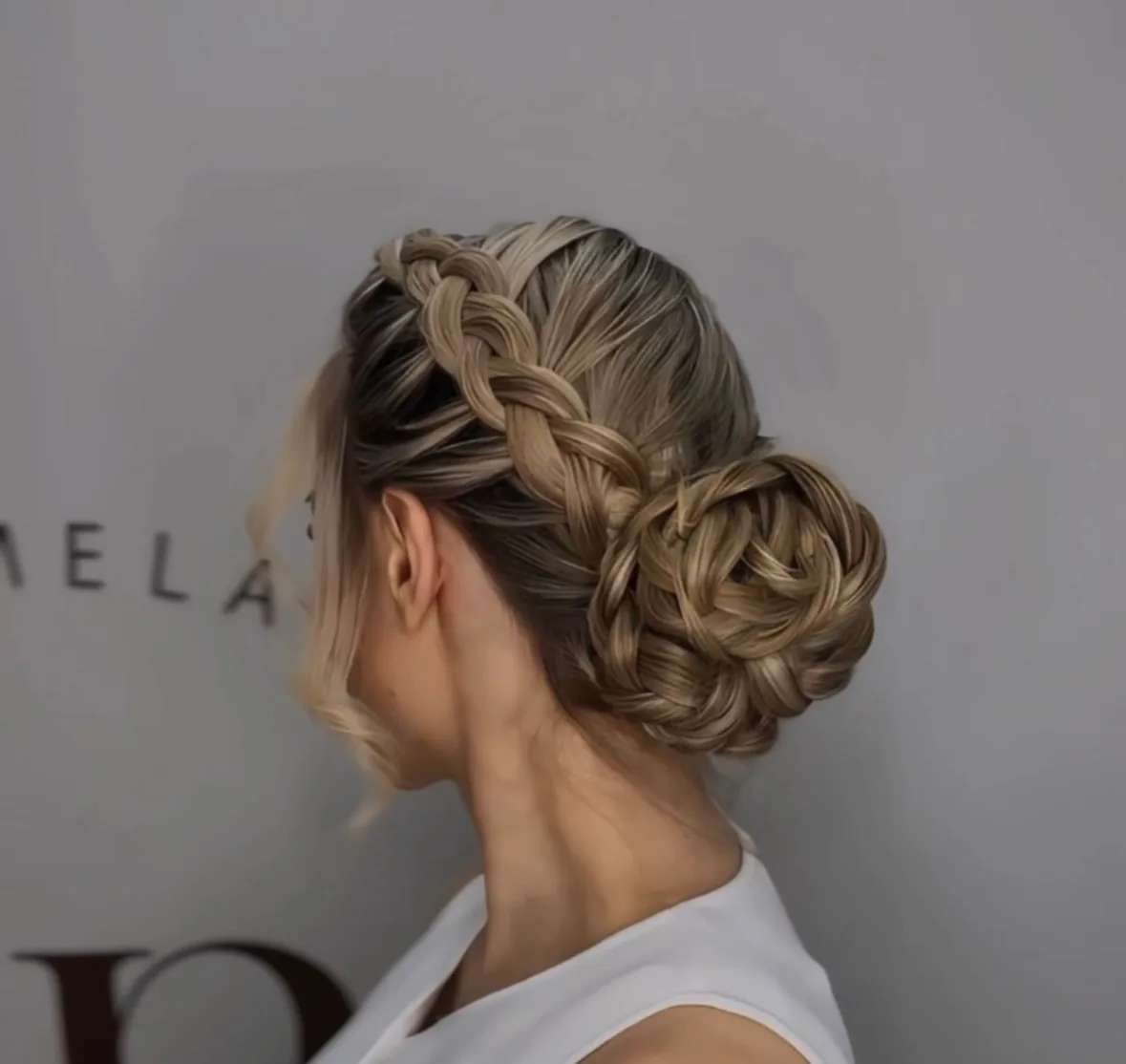 Braided updo styled at Karmela Beauty Lounge