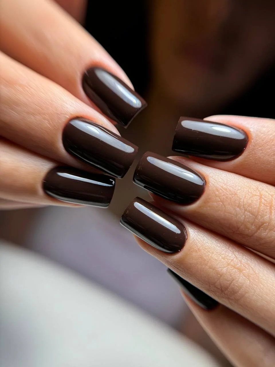 Glossy dark brown manicure