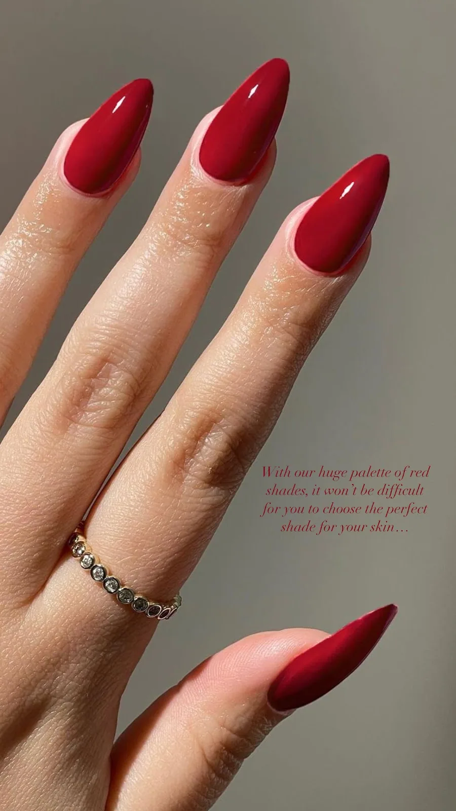 Glossy red almond manicure