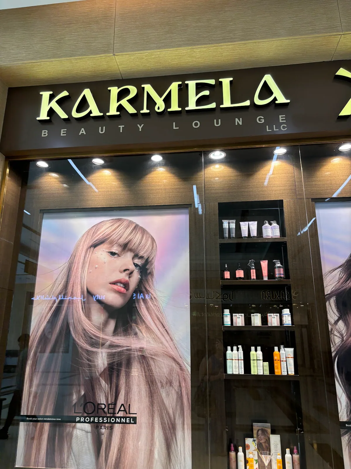 Karmela Beauty Lounge storefront inside Warqa Mall with product display