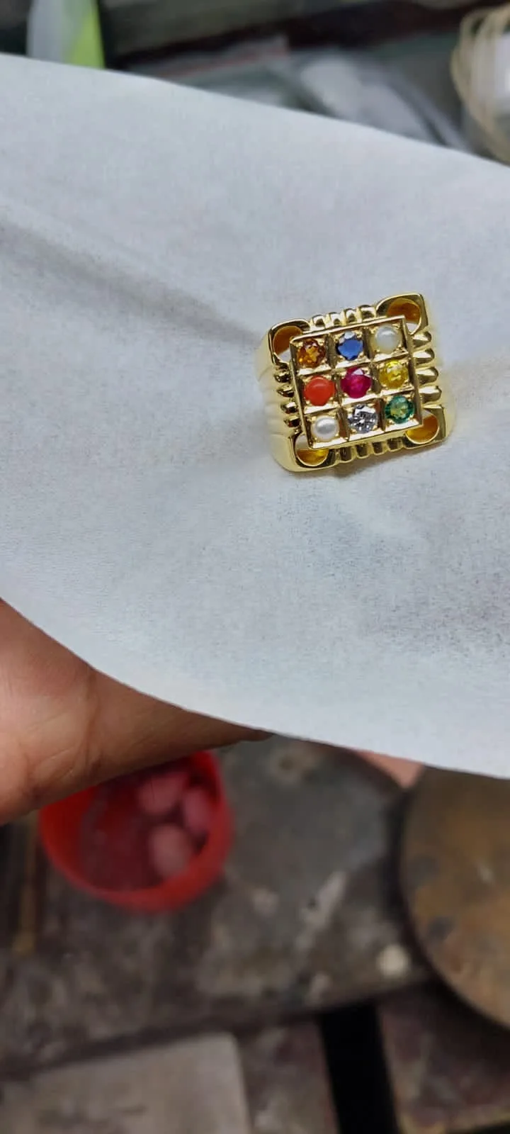 Navratna nine-gemstone gold ring