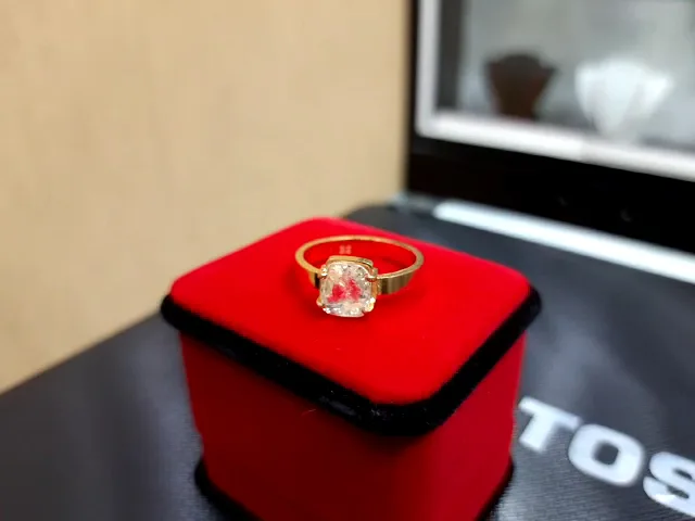 Diamond solitaire ring presented in a ring box