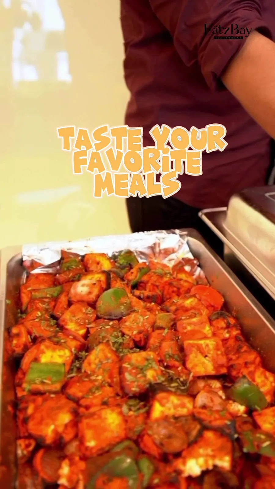 A tray of freshly grilled paneer tikka being prepared in the Eatz Bay kitchen