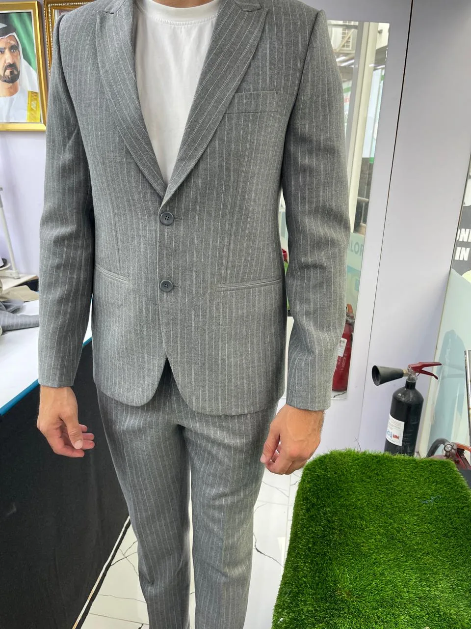 Made-to-measure grey pinstripe two-piece suit tailored at Rizwan Raza Gents Tailoring