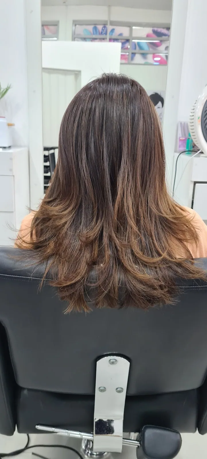 Layered balayage blow-dry styled at Ameera Beauty Salon