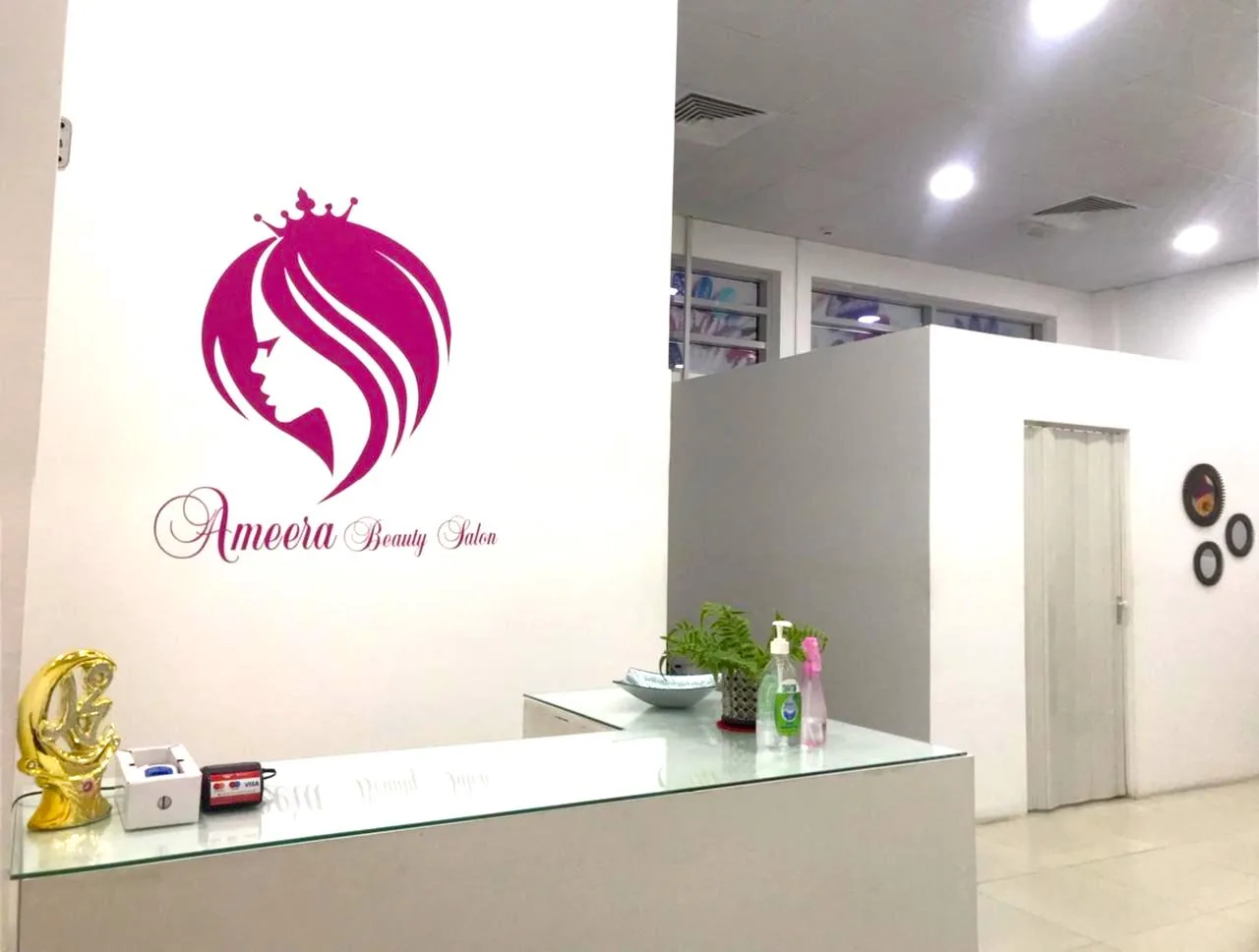 Ameera Beauty Salon reception and logo wall