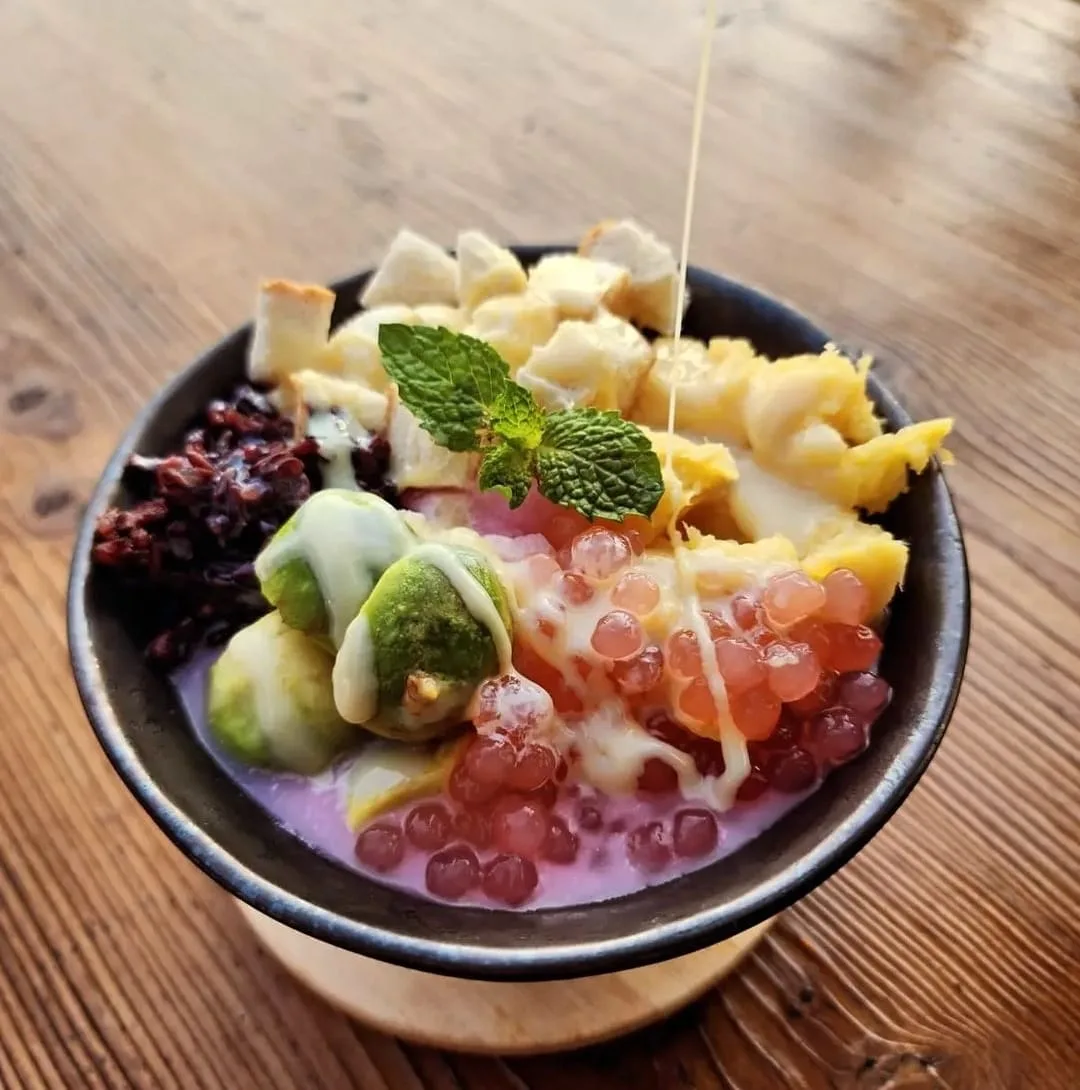 Es campur mixed iced dessert bowl topped with mint