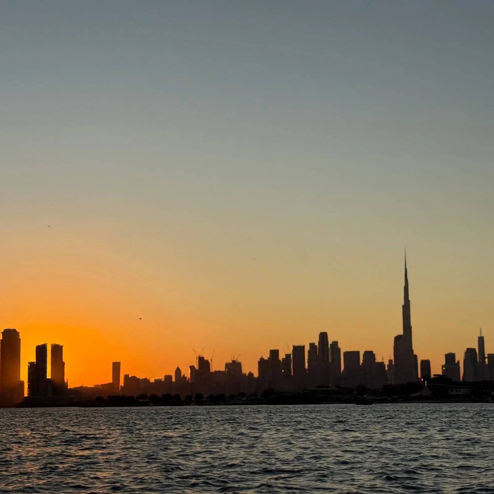 Dubai skyline at sunset with the Burj Khalifa
