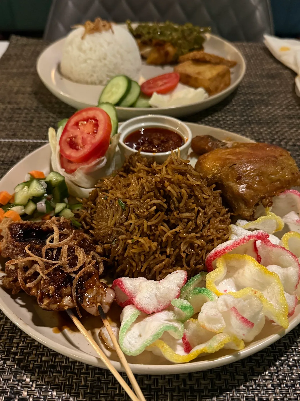 Nasi goreng platter with fried chicken, satay and crackers