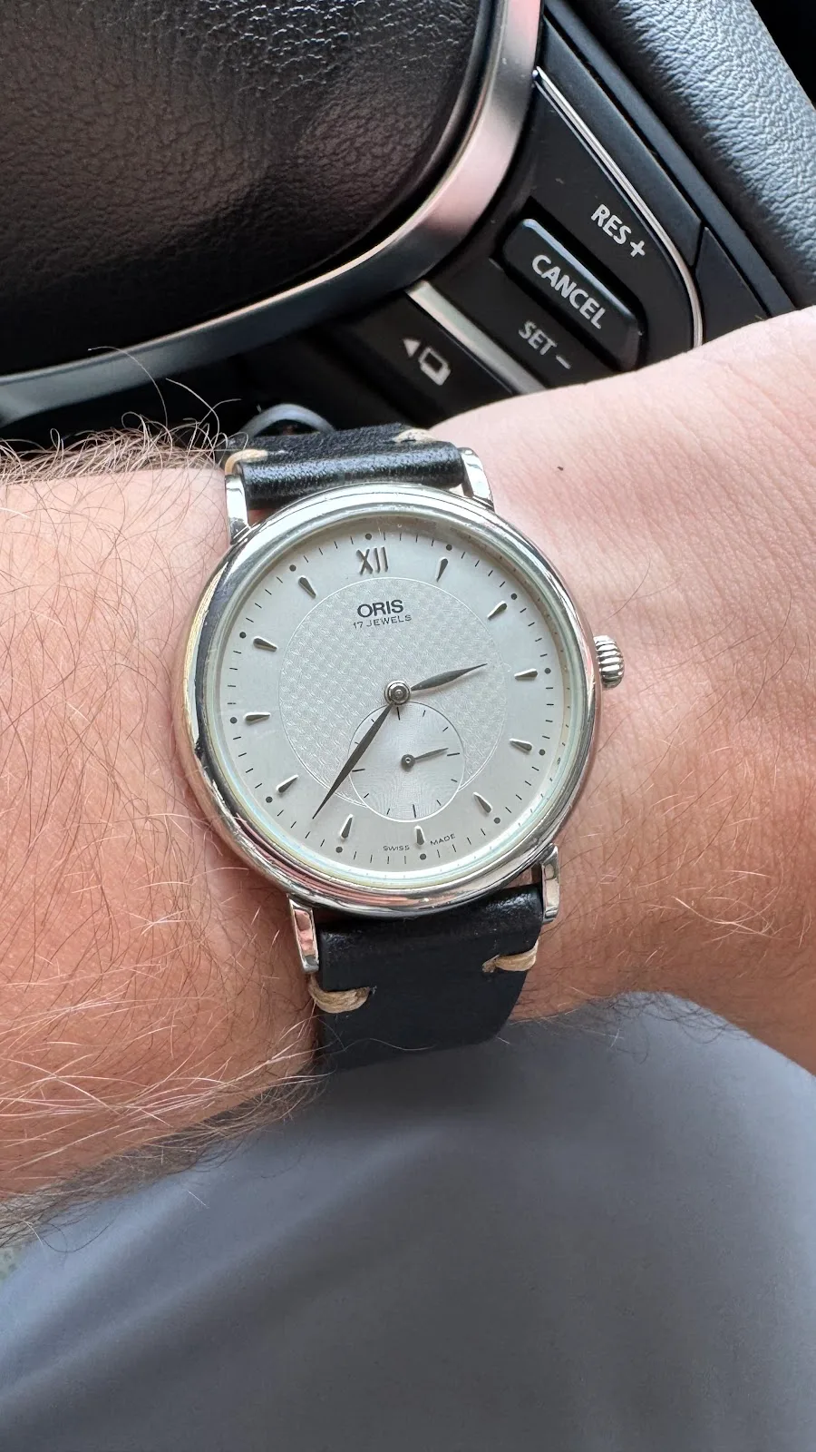 A serviced Oris dress watch on a leather strap