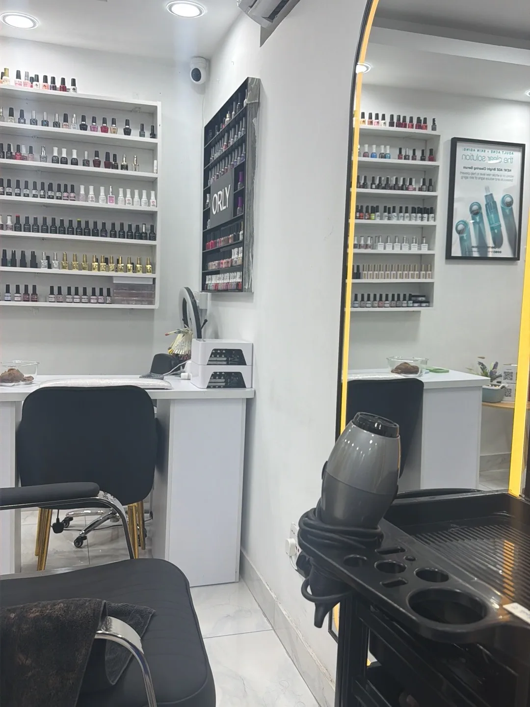 Inside Jini Glam salon with nail polish shelves
