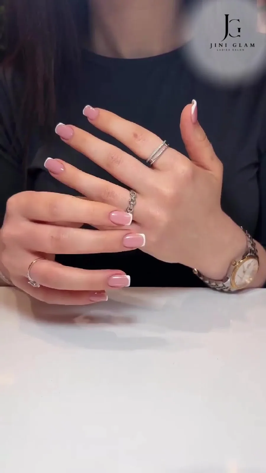 Close-up of a soft pink French gel manicure done at Jini Glam Ladies Salon