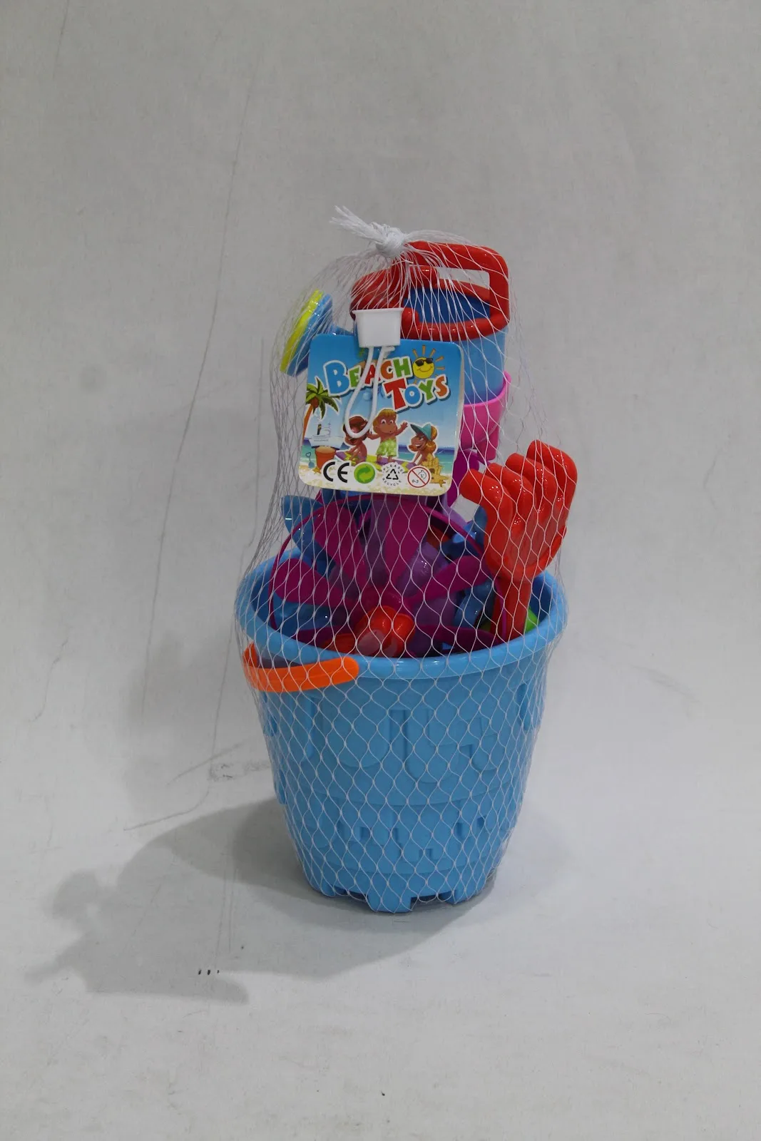 Blue bucket beach toy set in netting