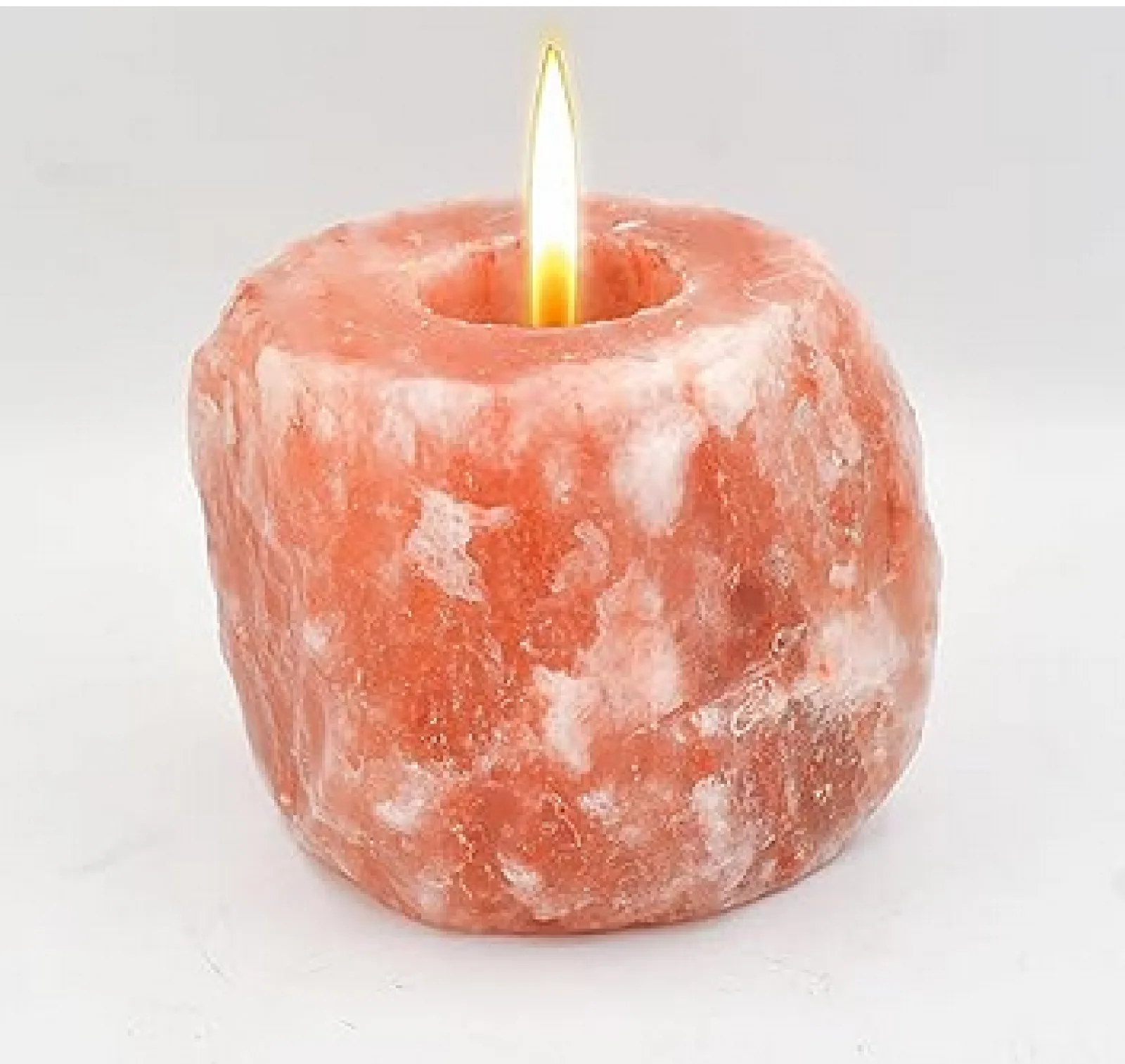 Glowing Himalayan rock-salt candle holder with a lit candle