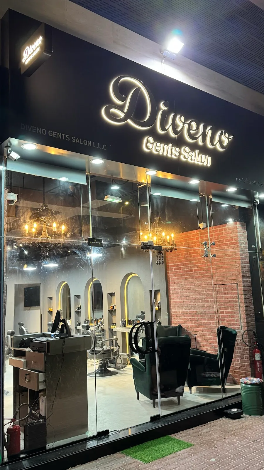 Diveno Gents Salon storefront lit up at night
