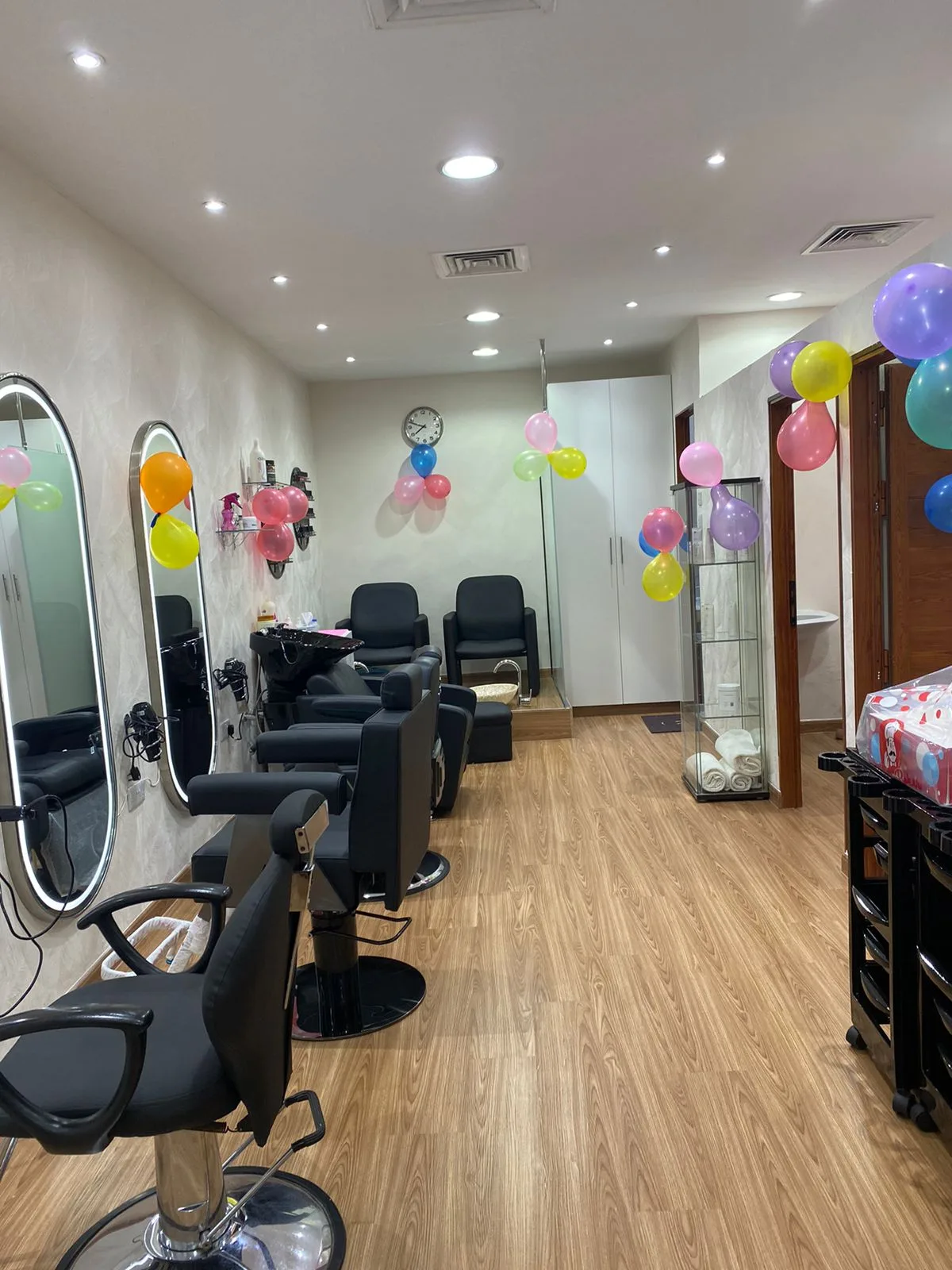 Inside New Look Beauty Salon in Al Karama, with styling chairs and lit mirrors