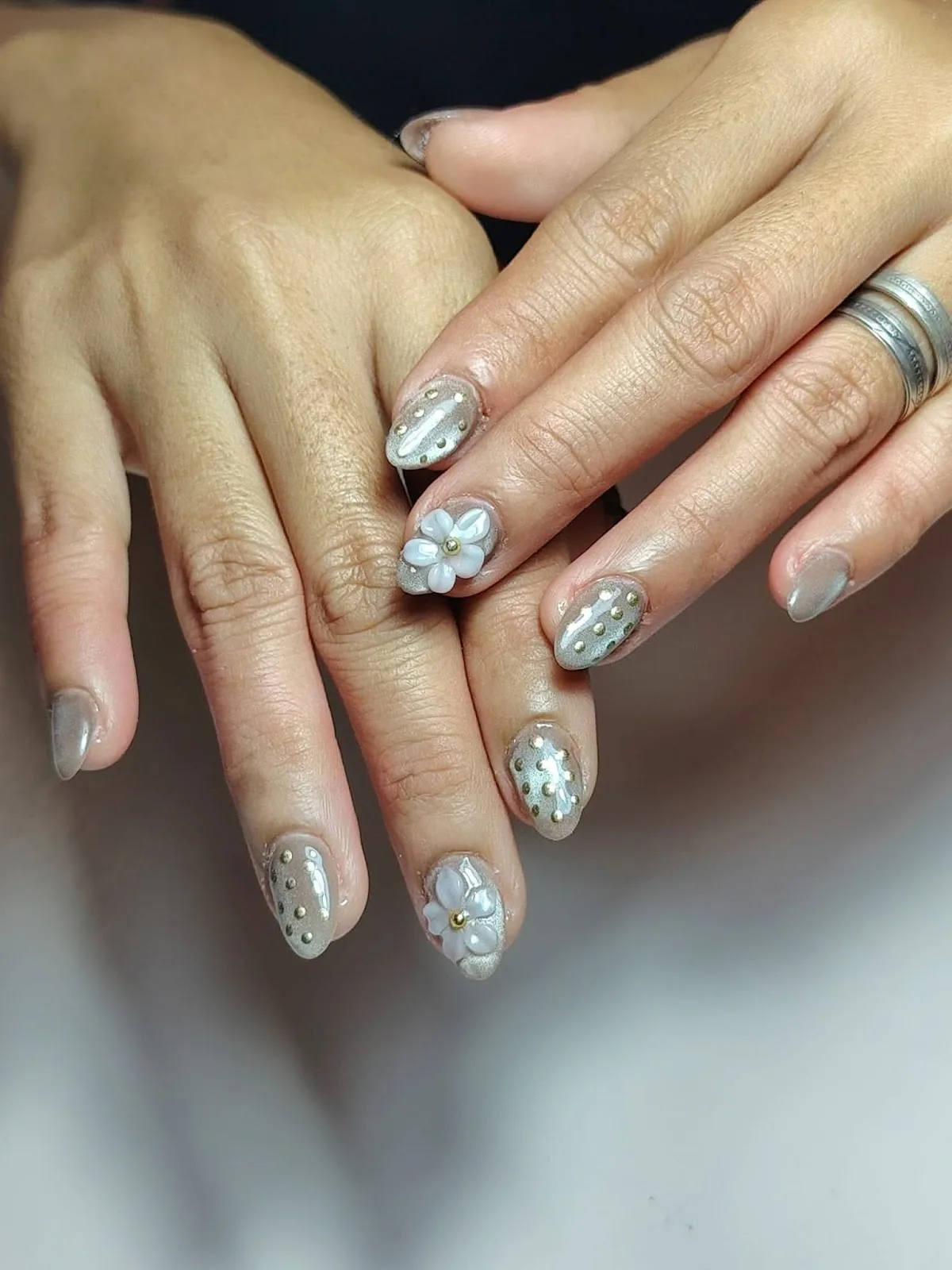 Nail art with 3D flowers and gold studs