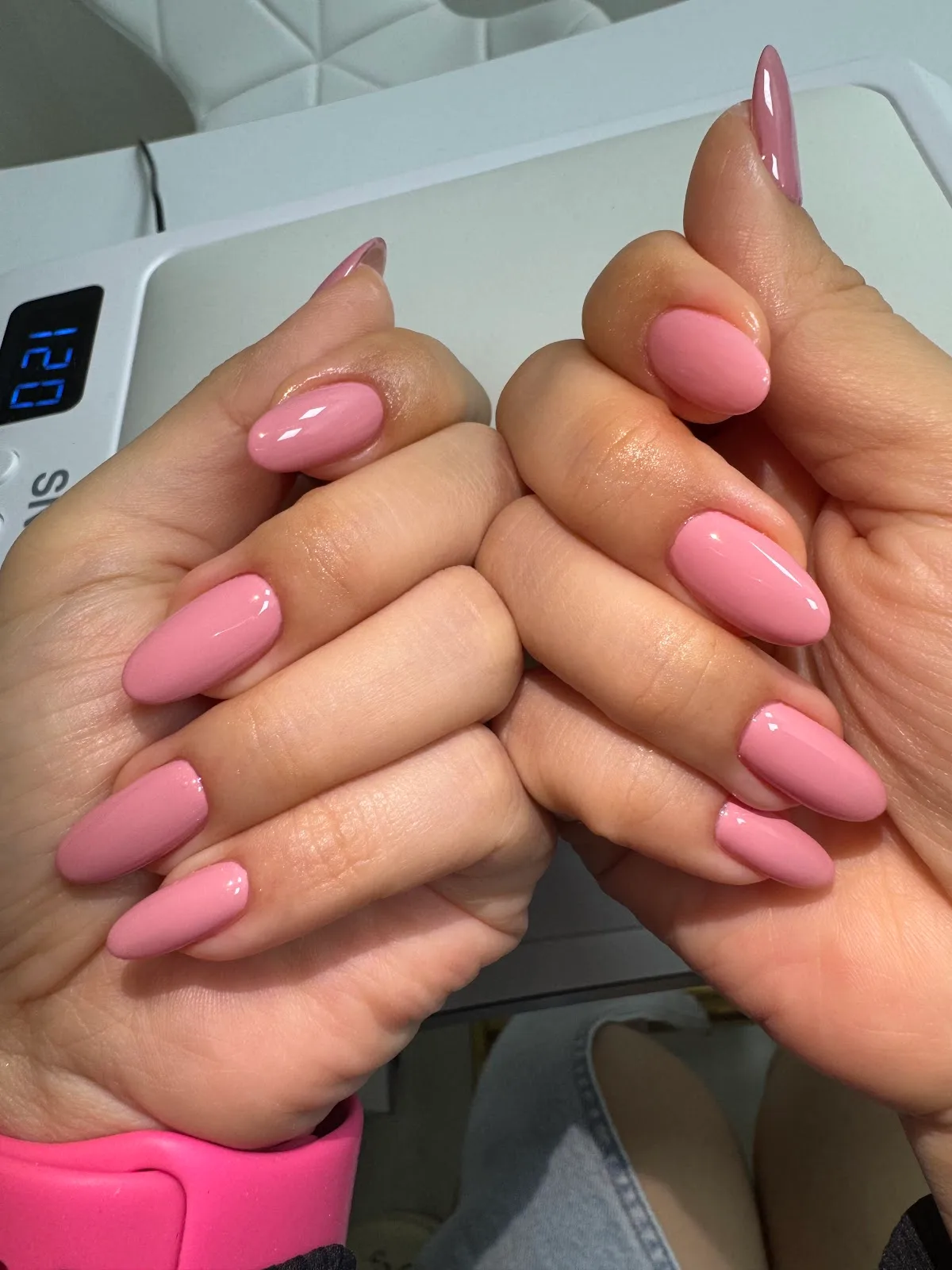 Glossy pink almond gel nails