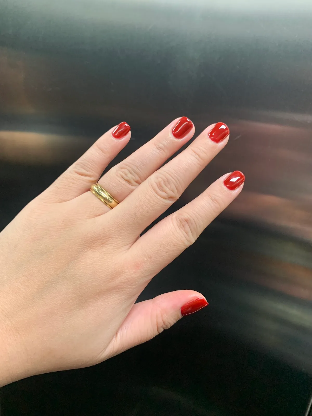Amber and black nails with gold-foil detailing