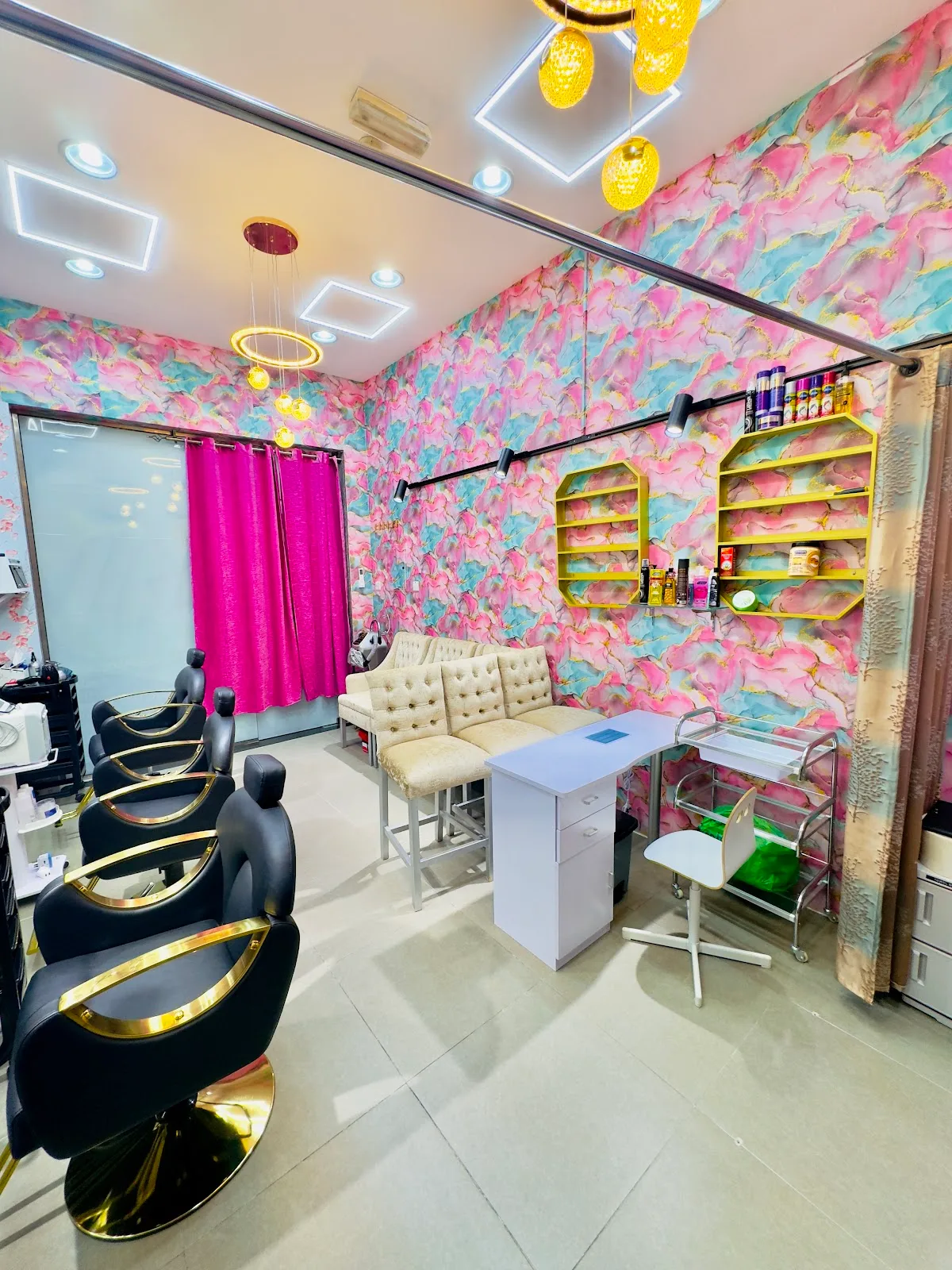 Inside Yathreeb Al Makkah Ladies Salon, with styling chairs and a colourful feature wall