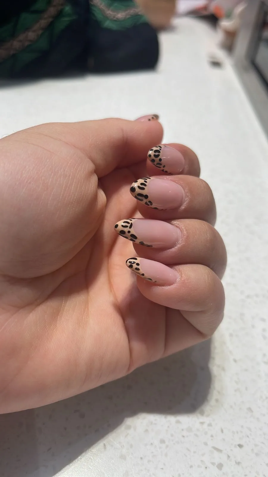 Almond nails with leopard-print French tips
