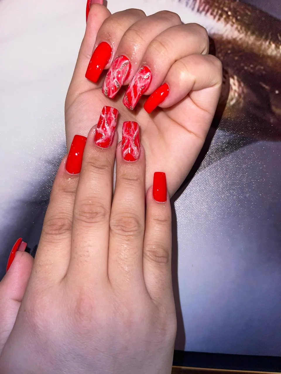 Red marble-effect long nails