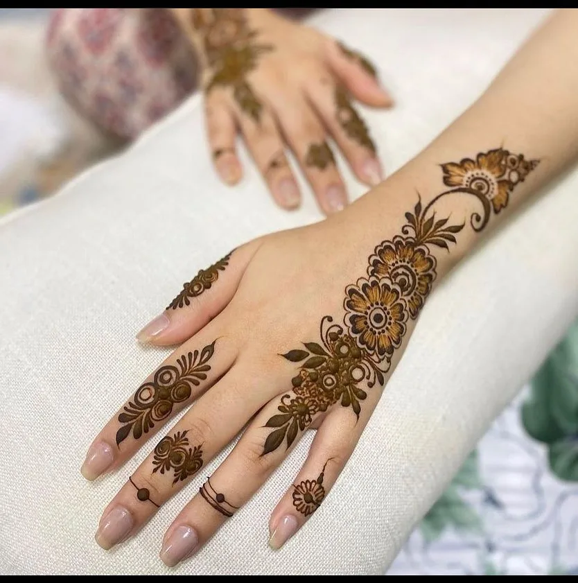 Floral henna design on hand