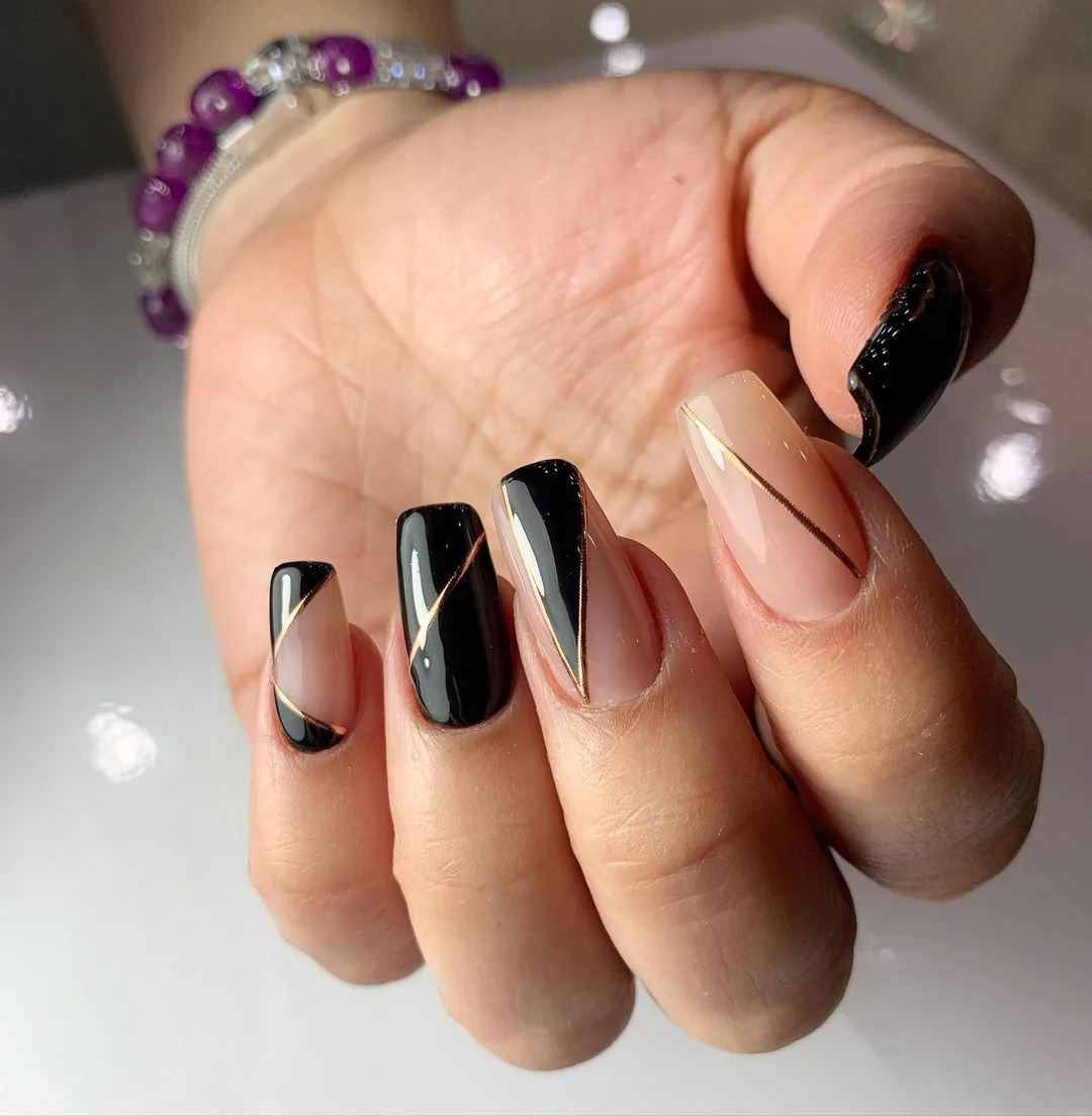 Black and gold geometric nail art