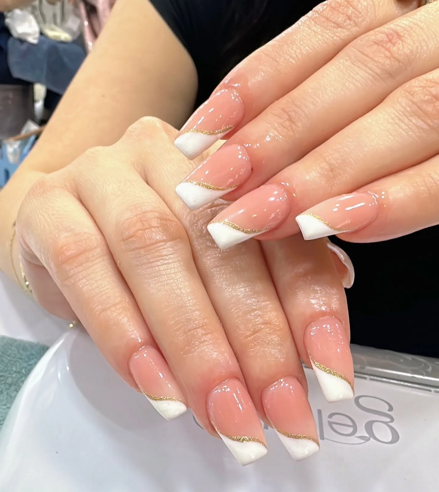 Nude French nails with gold line detail